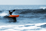 Catching a wave in the Design Kayaks Awesome sea kayak