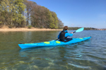 Paddling the Design Kayaks Unplugged sea kayak in calm, sheltered waters