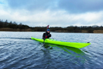 Cruising on calm water in the Design Kayaks Unplugged sea kayak