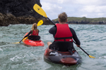 Paddling in a pair along the coastline in the Wavesport Scooter X Sit On Top Kayaks